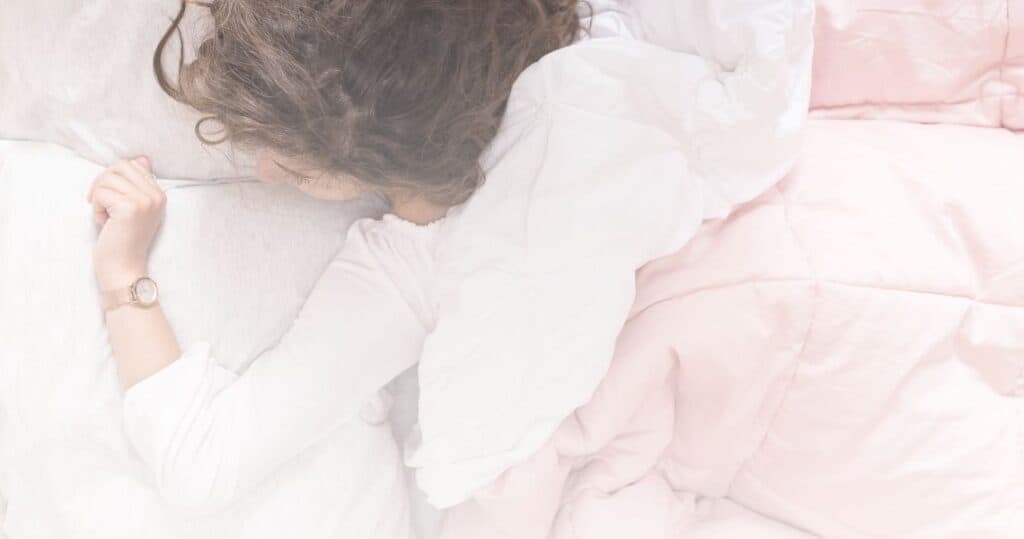 Woman sleeping on a bed